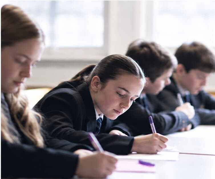 Pupils writing at Fulwood Academy