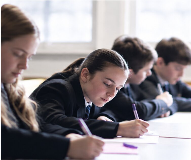 Pupils writing at Fulwood Academy
